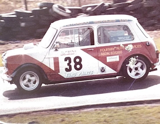 Classic Mini number 38 racing at circuit
